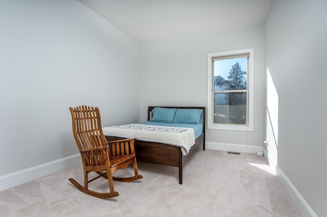 bedroom with baseboards, visible vents, and carpet floors
