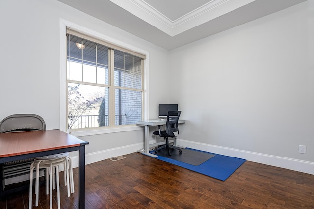 office space with baseboards, wood finished floors, and crown molding