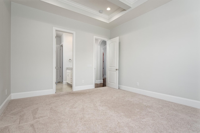 unfurnished bedroom featuring crown molding, recessed lighting, baseboards, connected bathroom, and light carpet