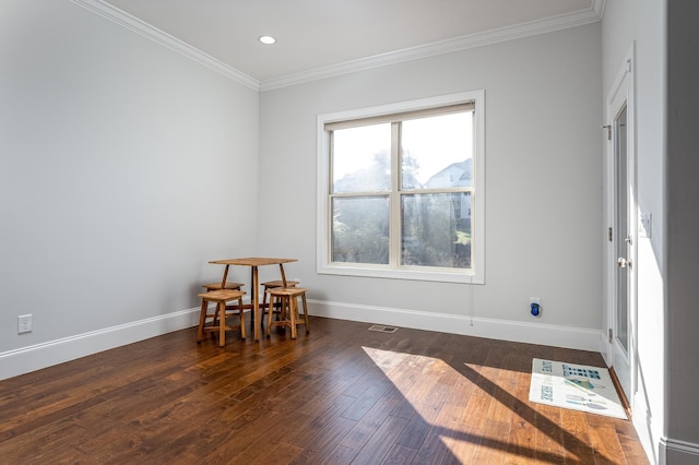 empty room with visible vents, crown molding, baseboards, recessed lighting, and dark wood finished floors