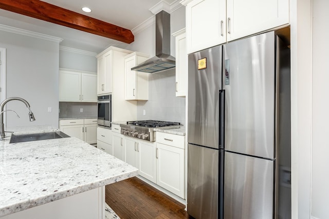 kitchen with decorative backsplash, beamed ceiling, wall chimney exhaust hood, stainless steel appliances, and a sink