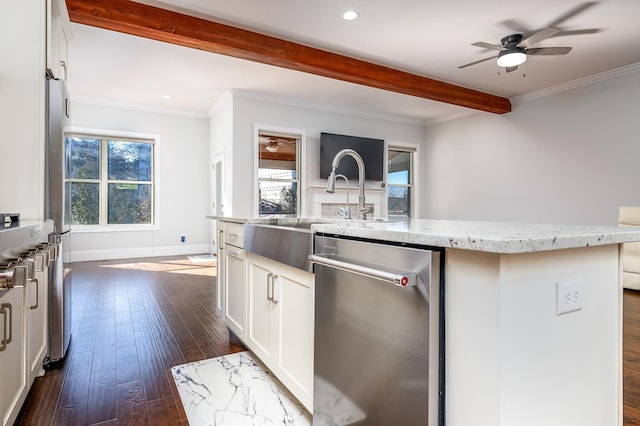 kitchen with stainless steel dishwasher, dark wood-style floors, beamed ceiling, and light stone countertops