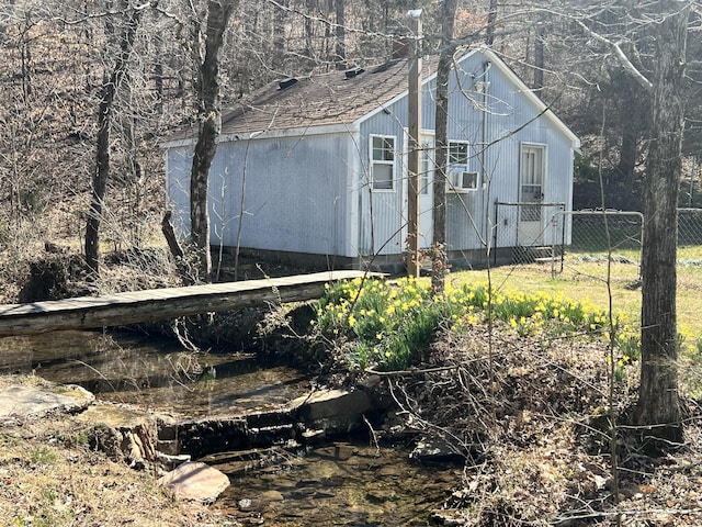 3795 Wayland Springs Rd, Iron City, TN 38463 - view of side of home featuring fence and a shingled roof