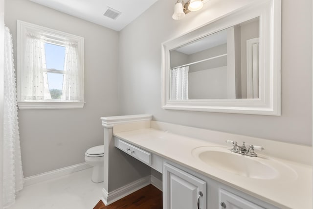 812 Deer Foot Ct, Nashville, TN 37221 - bathroom with baseboards, visible vents, toilet, and vanity