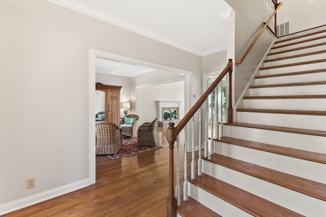 812 Deer Foot Ct, Nashville, TN 37221 - stairway featuring baseboards, visible vents, crown molding, and wood finished floors