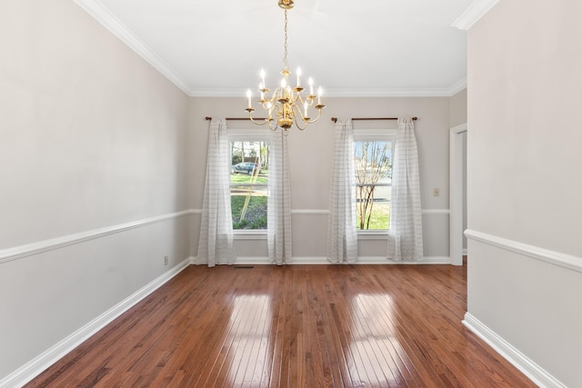 812 Deer Foot Ct, Nashville, TN 37221 - unfurnished dining area with baseboards, crown molding, hardwood / wood-style flooring, and a chandelier
