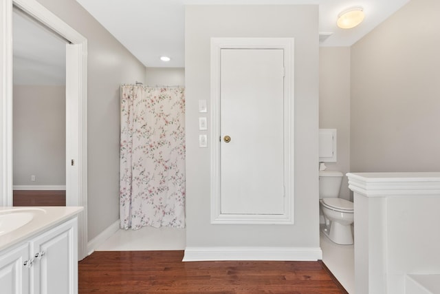 812 Deer Foot Ct, Nashville, TN 37221 - full bathroom featuring vanity, toilet, a shower with shower curtain, baseboards, and wood finished floors