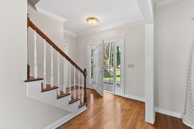 812 Deer Foot Ct, Nashville, TN 37221 - foyer with baseboards, wood finished floors, stairway, and crown molding