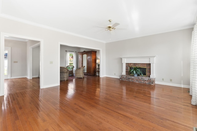 812 Deer Foot Ct, Nashville, TN 37221 - unfurnished living room with hardwood / wood-style floors, a brick fireplace, crown molding, and a ceiling fan