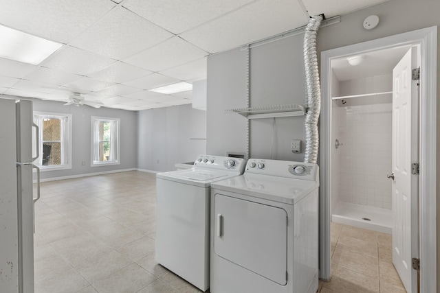 812 Deer Foot Ct, Nashville, TN 37221 - laundry area with washing machine and dryer, laundry area, light tile patterned floors, baseboards, and ceiling fan