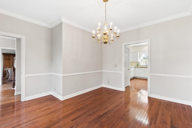 812 Deer Foot Ct, Nashville, TN 37221 - unfurnished dining area featuring an inviting chandelier, hardwood / wood-style floors, crown molding, and baseboards