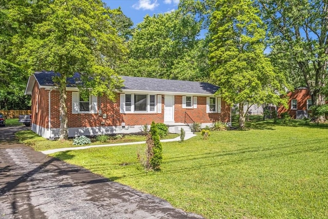 1309 Ovoca Rd, Tullahoma, TN 37388 - ranch-style house with brick siding and a front yard