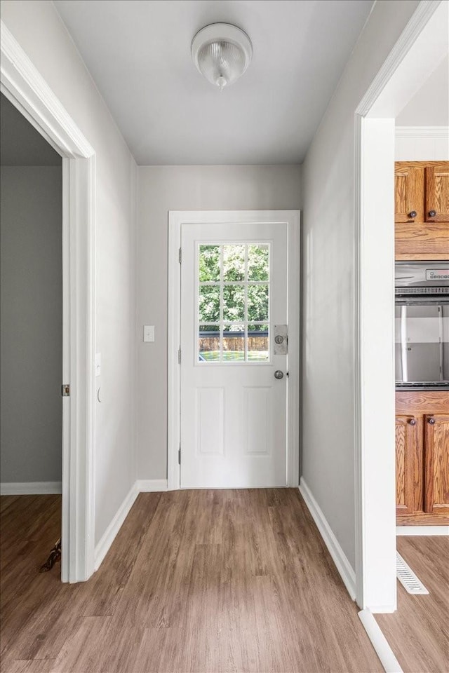 1309 Ovoca Rd, Tullahoma, TN 37388 - doorway to outside featuring wood finished floors and baseboards