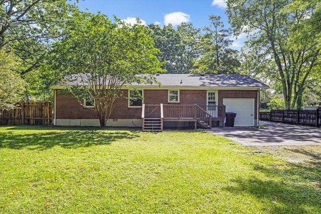 1309 Ovoca Rd, Tullahoma, TN 37388 - back of house featuring a garage, brick siding, and a wooden deck