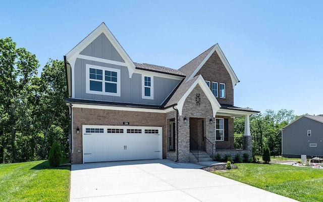 156 John T Alexander Blvd, Hendersonville, TN 37075 - craftsman inspired home featuring board and batten siding, driveway, an attached garage, a front yard, and a porch