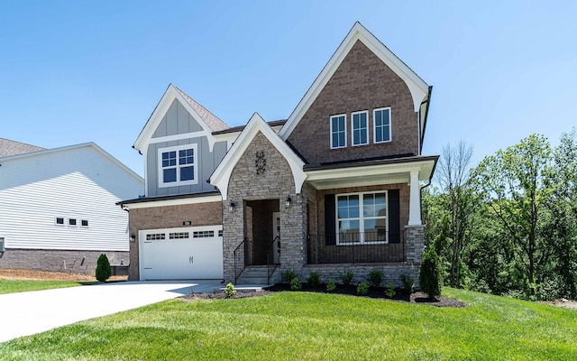 156 John T Alexander Blvd, Hendersonville, TN 37075 - craftsman-style home featuring board and batten siding, driveway, a garage, a front lawn, and stone siding