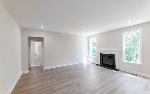156 John T Alexander Blvd, Hendersonville, TN 37075 - unfurnished living room featuring light wood-style floors, a fireplace with flush hearth, baseboards, and recessed lighting