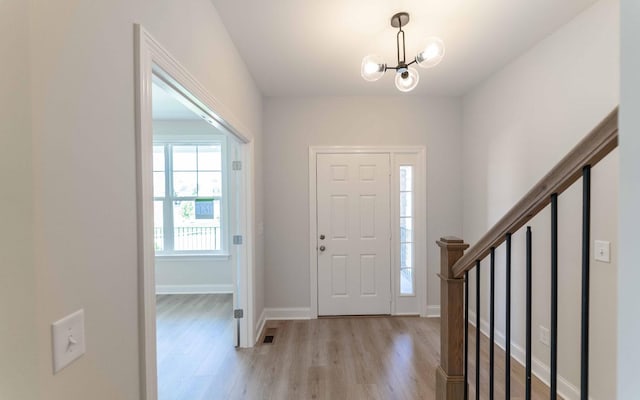 156 John T Alexander Blvd, Hendersonville, TN 37075 - entrance foyer featuring light wood-type flooring, a chandelier, and baseboards