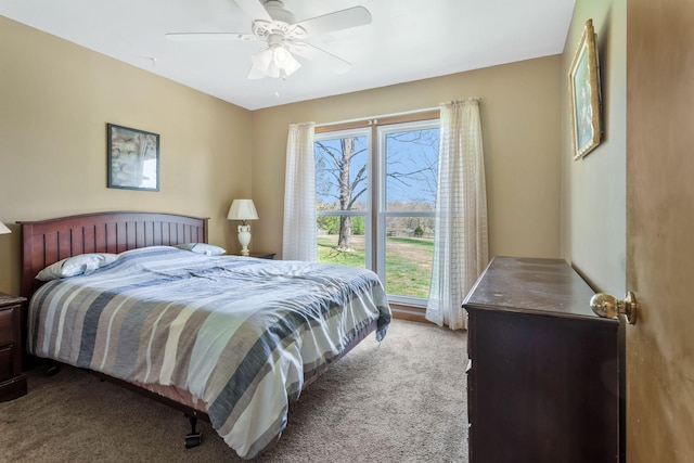 carpeted bedroom with a ceiling fan