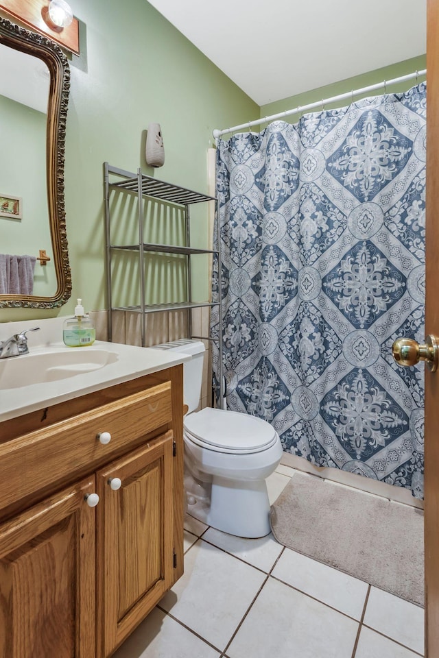 bathroom with tile patterned floors, vanity, toilet, and a shower with shower curtain