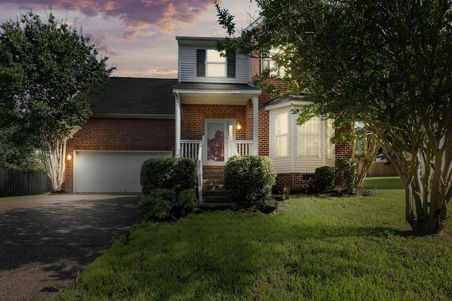 4009 Wellington Ct, Old Hickory, TN 37138 - traditional-style home featuring asphalt driveway, a garage, brick siding, and a shingled roof