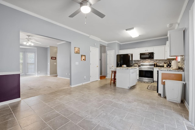 4009 Wellington Ct, Old Hickory, TN 37138 - kitchen featuring black appliances, ceiling fan, ornamental molding, open floor plan, and a center island