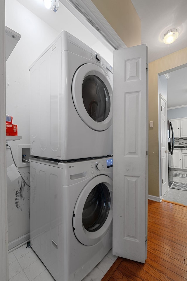 4009 Wellington Ct, Old Hickory, TN 37138 - laundry room featuring estacked washer and dryer and light wood-type flooring