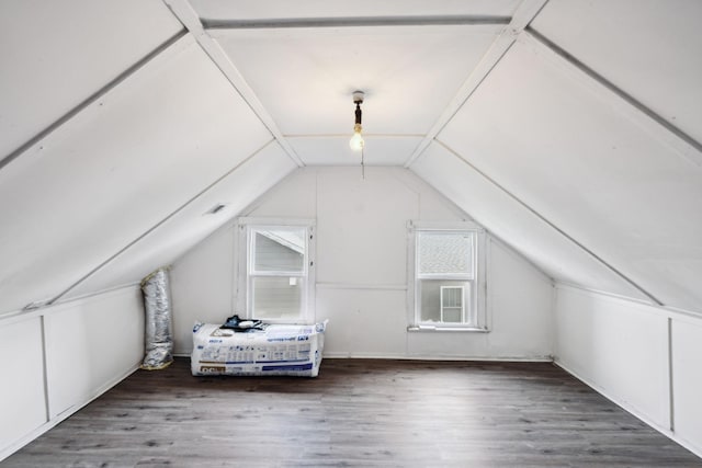 bonus room with wood finished floors and lofted ceiling