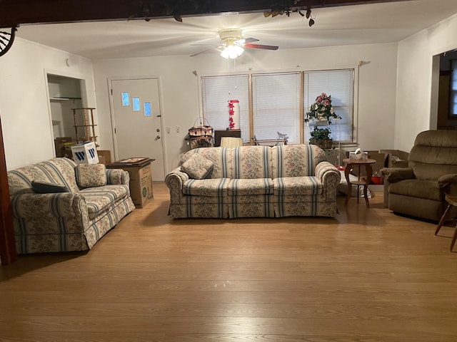 living room featuring wood finished floors and ceiling fan