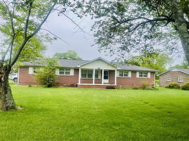 212 Crest Dr, Tullahoma, TN 37388 - rear view of property with a lawn, covered porch, crawl space, and brick siding