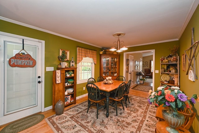 1935 Liberty Ln, Gallatin, TN 37066 - dining room featuring a notable chandelier, baseboards, ornamental molding, and wood finished floors