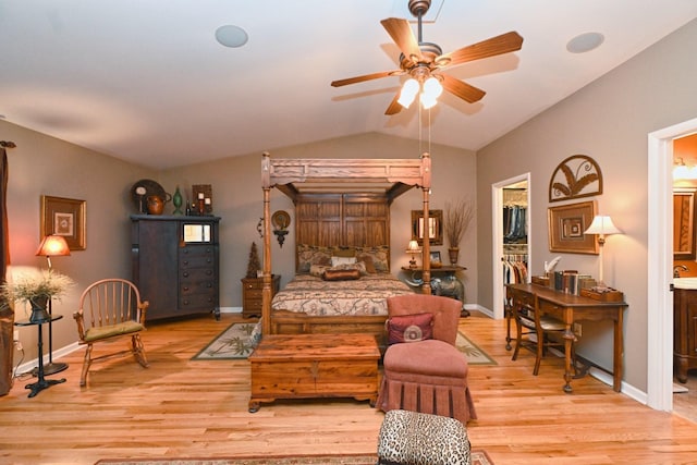 1935 Liberty Ln, Gallatin, TN 37066 - bedroom featuring light wood-style floors, ensuite bath, vaulted ceiling, a walk in closet, and baseboards