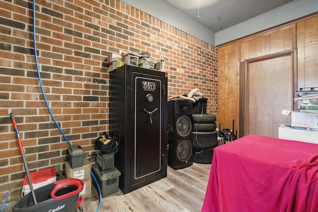12 Dukes Ln, Kelso, TN 37348 - bedroom featuring light wood-style floors and brick wall