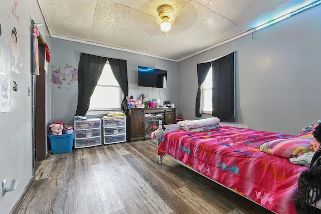 12 Dukes Ln, Kelso, TN 37348 - bedroom featuring a ceiling fan, crown molding, wood finished floors, and multiple windows