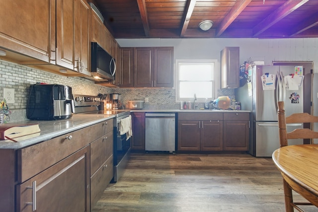 12 Dukes Ln, Kelso, TN 37348 - kitchen with appliances with stainless steel finishes, dark wood-style flooring, a sink, wooden ceiling, and decorative backsplash