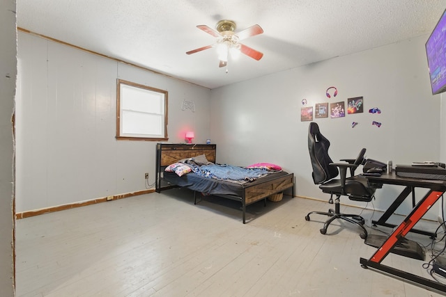 12 Dukes Ln, Kelso, TN 37348 - bedroom featuring a textured ceiling, baseboards, a ceiling fan, and hardwood / wood-style flooring