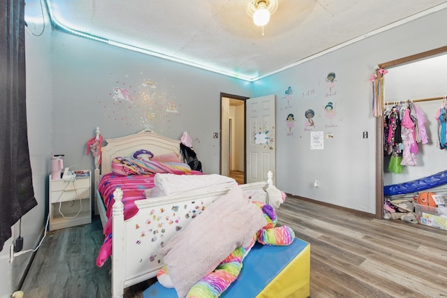 12 Dukes Ln, Kelso, TN 37348 - bedroom featuring a closet, baseboards, and wood finished floors