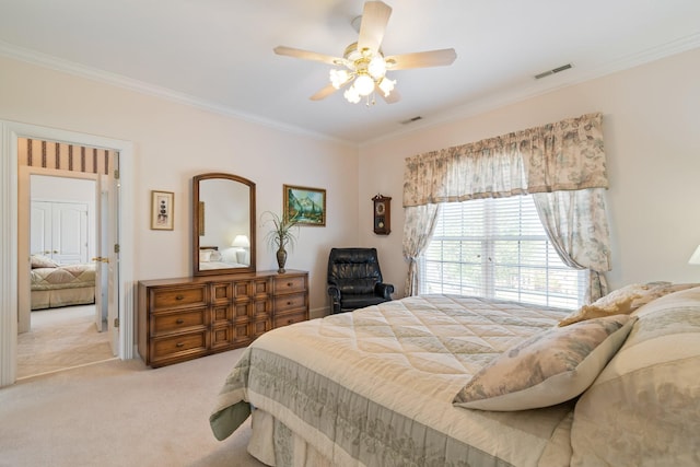 bedroom with ornamental molding, ceiling fan, light colored carpet, and visible vents
