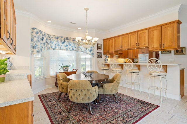 dining space with light tile patterned flooring, an inviting chandelier, and ornamental molding