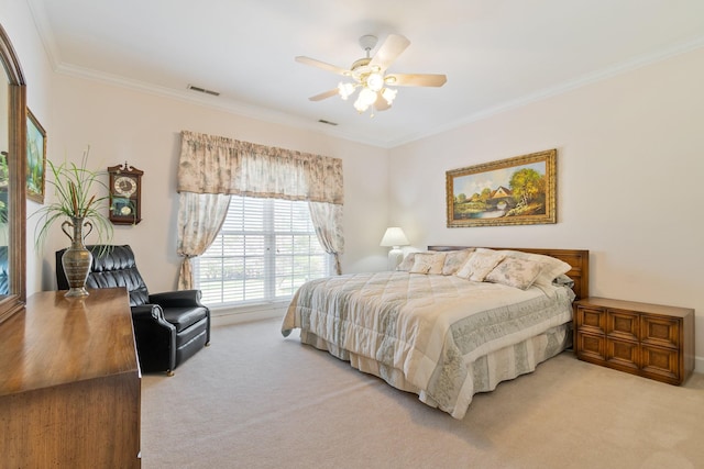 bedroom with visible vents, light colored carpet, ornamental molding, and ceiling fan