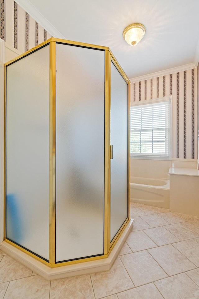 full bathroom featuring crown molding, a shower stall, a bath, tile patterned floors, and wallpapered walls