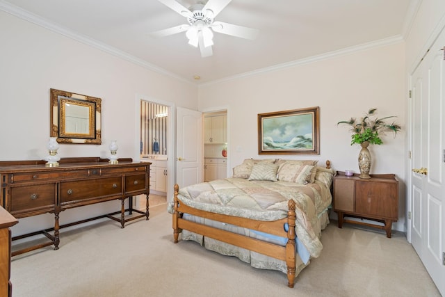 bedroom with crown molding, light colored carpet, ensuite bath, and a ceiling fan