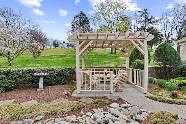 view of patio / terrace featuring a pergola and outdoor dining area