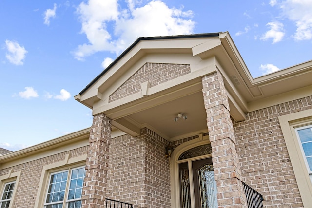 exterior space featuring brick siding