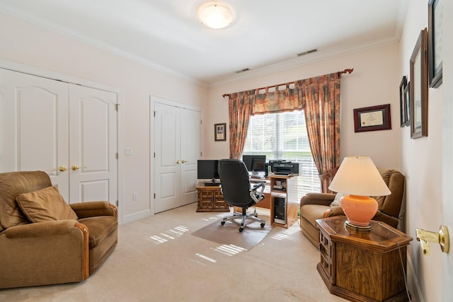office area with crown molding, visible vents, and carpet floors