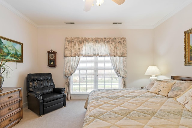 bedroom with ornamental molding, visible vents, ceiling fan, and light carpet