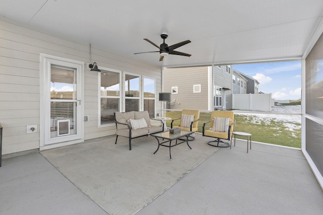 sunroom / solarium with ceiling fan