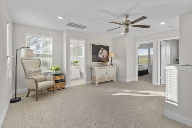 living area featuring recessed lighting, visible vents, light colored carpet, and ceiling fan