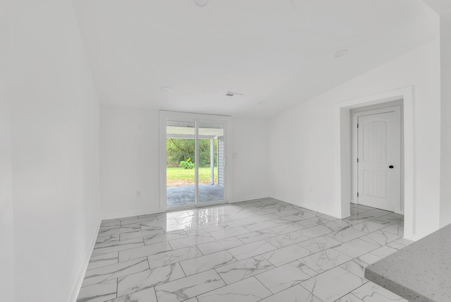 empty room with baseboards and marble finish floor