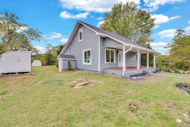 view of side of home with an outbuilding, a lawn, and a shed